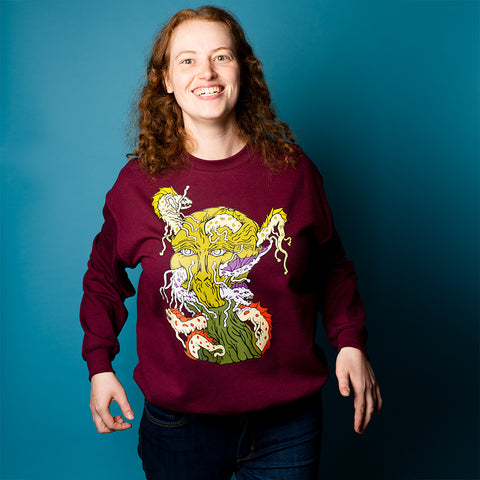 Overtaken. Buy this maroon soft and comfy crewneck sweatshirt featuring weird and original artwork from Danica Daydreams.
